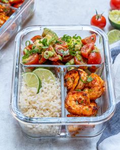 a plastic container filled with rice, shrimp and veggies on top of a table