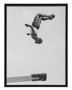 a man flying through the air while riding a skateboard