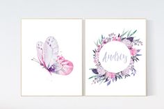 two watercolor paintings with flowers and butterflies on them, one has the word audrey written in