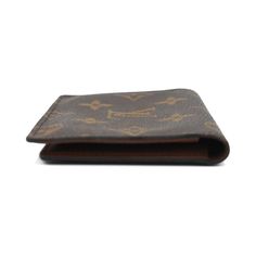 Louis Vuitton bi-fold wallet in brown monogram coated canvas with two clear card slots on the brown leather lined interior. Brand = Louis Vuitton Condition = 7/10, Good, light wear to glue trim, light scratches and discolouration to clear slots Dimensions = 4.5" x 3.5" x 0.5" Material = Coated Canvas SKU = 22709-1772 Designer Brown Bifold Card Holder, Classic Monogram Canvas Wallet For Business, Designer Brown Card Holder For Formal Use, Designer Brown Card Holder For Formal Occasions, Classic Wallet In Monogram Canvas With Original Box, Classic Monogram Canvas Wallet, Classic Rectangular Wallet In Monogram Canvas, Luxury Brown Card Holder With Coin Pocket, Classic Rectangular Monogram Canvas Wallet