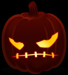 a carved pumpkin with glowing eyes and teeth