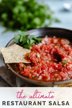 a bowl filled with salsa and tortilla chips