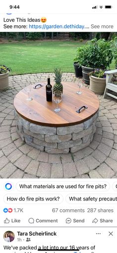 an image of a table with wine glasses on it in the middle of a brick patio