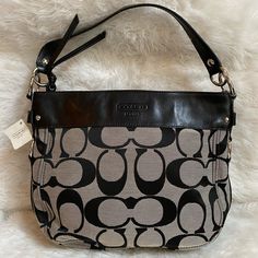 Nwt Coach Signature Zoe Shoulder Bag F14708 Msrp $348 Sv/Black / White/Black Features: Zipper Department: Women Strap Drop: 7" Pattern: Jacquard Look: Hobo Lining Material: Leather Bag Height: 10" Size: Medium To Large Country/Region Of Manufacture: China Material: Leather Style Subtype: Hobo Bag Length: 13" Texture: Jacquard Bag Depth: 3.5" Brand: Coach Style: Hobo Color: Black With Silver Hardware Closure: Zipper Follow Me On Insta Joy_closet4u Selling My Authentic Brand New/ Unused Collection Classic Coated Canvas Shoulder Bag With Silver-tone Hardware, Luxury Gray Shoulder Bag With Leather Handles, Shopping Shoulder Bag With Silver-tone Hardware And Coated Canvas, Chic Gray Shoulder Bag With Silver-tone Hardware, Elegant Coated Canvas Shoulder Bag With Silver-tone Hardware, Black Shoulder Bag With Leather Handles And Coated Canvas, Formal Bags With Silver-tone Hardware In Coated Canvas, Designer Gray Top Handle Shoulder Bag, Classic Shoulder Bag With Gunmetal Hardware