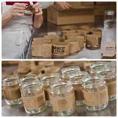 several jars with labels on them sitting on a table