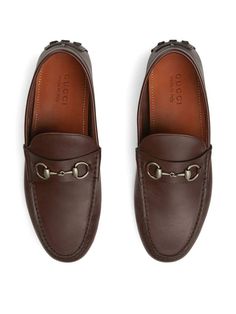 Gucci's driver loafers crafted in brown smooth leather. Featuring a round-toe silhouette, leather lining and pebbled rubber sole. The design is completed by the iconic silver-tone metal Horsebit.Gender: MENMaterial: 100% CALF SKINColor: COCOAMade in: ITProduct ID: 7658591XH002140*Import tax/duty will be calculated at checkout (If applicable) Gucci Brown Loafers With Rubber Sole, Brown Gucci Loafers With Rubber Sole, Brown Gucci Slip-on Loafers, Gucci Designer Brown Loafers, Designer Brown Gucci Loafers, Luxury Brown Gucci Loafers, Gucci Calf Leather Shoes With Leather Sole, Gucci Leather Shoes With Calf Leather Sole, Gucci Brown Shoes With Leather Sole