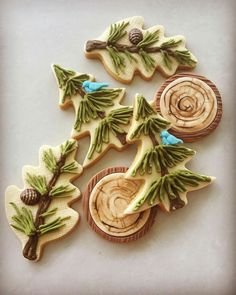 decorated cookies are arranged in the shape of trees