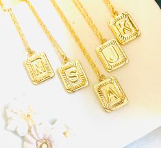 "Gold Alphabet square necklace, Square initial necklace for her, Gold square initial necklace, Alphabet, gift, Bridesmaid Personalized Gift This necklace has gift box. (individually) This rectangle necklace is made with all 18K Gold plated pendant and Twist chain too. It is comfortable to wear, minimalist, and chic. Also, Nickel-free and Lightweight, perfect for everyday wear. Details: CHAIN LENGTH ADJUSTABLE: 16\" - Length extender: 2\" inch extension -Pendant Size: 24 x 16 mm -Thickness: 1.8 m Silver Rectangular Initial Necklace, Personalized Initials Necklace With Square Pendant, Square Pendant Necklace With Initials For Personalized Gift, Dainty Initials Charm Necklace With Square Pendant, Gold Rectangular Initial Necklace, Dainty Charm Necklaces With Initials On Square Pendant, Rectangular Initials Necklace For Personalized Gift, Personalized Initial Square Pendant Necklace For Anniversary, Personalized Square Pendant Initial Necklace For Anniversary