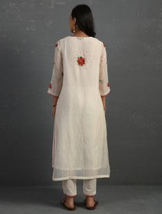 A straight-cut kurta in cotton silk fabric with all-over floral buttis made using beads, sequins and silk French knots. Kurta, pants and dupatta have a lace edging at the hem, side cut, and sleeve ends. Bead work runs along the neckline and in between lace patterns. Delicate pin tucks stitched across the organza dupatta with embroidered scalloped edges and machine stitches in between pin tucks. Elasticated waist comfortable fully lined pants with draw strings. Kurta measurements (in Inches): Siz Machine Stitches, Kurta Pants, Cotton Silk Fabric, Silk Kurta, French Knots, Organza Dupatta, Blue Hand, Kurta Set, Lace Edging