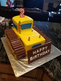 a birthday cake made to look like a bulldozer