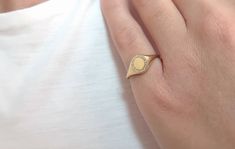 This small solid gold frame ring is set with diamonds! You can write your favorite letter as all letters are available ( or numbers) and create your personalized signet ring. The possibilities to engrave it are endless, your initials, your beloved s initials, your kids, etc. ✔ Made to Order ✔ Gold Kt: 9k-14K-18k ✔ Available Gold Color: Rose Gold, Yellow Gold, White Gold ✔ Gemstone: Genuine Diamonds, or other genuine gemstones ✔ Stone Cut: Round ✔ Number of Stones: 20 ✔ Setting Type: Micropave ✔ Frame Ring, Diamond Frame, Gold Signet Ring, Gold Gift, Solid Gold Jewelry, Stone Cuts, Pure Gold, Signet Ring, Gold Yellow