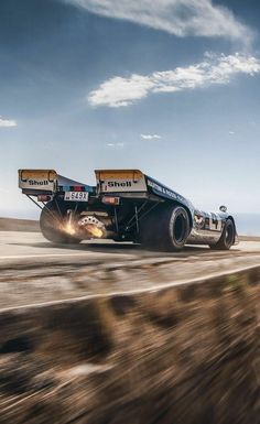 a drag car is making a sharp turn on the track with its front wheels in motion