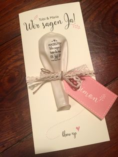 a card with a bottle and tag on top of it that says, we are married