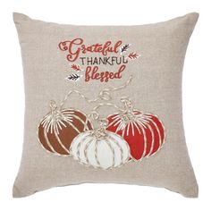 a pillow with two pumpkins on it that says grateful, thank and be loved