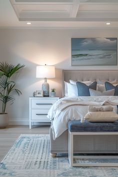 a bedroom with a large bed and blue accents