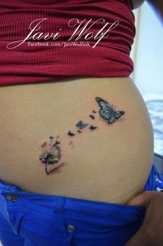 a pregnant belly with butterflies on it