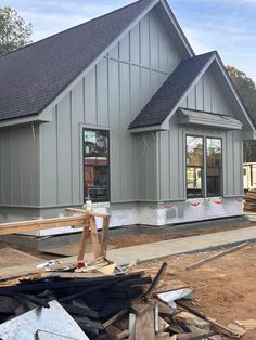 a house being built in the process of being remodeled with wood and siding on the outside