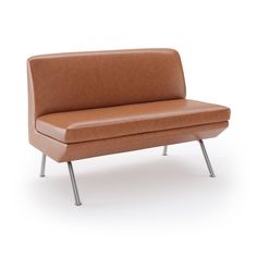 a brown leather couch sitting on top of a metal frame