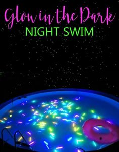 glow in the dark night swim with pink and blue lights on it's surface