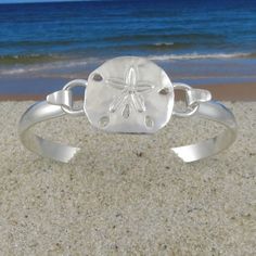 Cape Cod Convertible Sterling Silver Sand Dollar Bracelet Adjustable Round Cuff Bracelet With Sterling Silver Clasp, Adjustable Cuff Bracelet With Sterling Silver Clasp, Silver Bangle With Clasp, Elegant Silver Bracelets With Interchangeable Details, Silver Bangle Jewelry With Clasp, Silver Sterling Silver Bracelets With Clasp, Sterling Silver Bracelets With Clasp, Adjustable Silver Bracelet With Clasp, Adjustable Sterling Silver Bracelet With Clasp