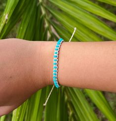 Our Kanapaha Bracelet is one of a kind featuring natural turquoise and an intricate design. This style is sure to stand out and embodies the bright blue waves. Natural turquoise stones Wax Cord approx 6" with adjustable 3.5" knot - adjustable and waterproof! Matching necklace and anklet!  Mix and match with your favorite HALT pieces or wear alone for boho beach vibes. The perfect gift for him or her. Our jewelry is handmade in the Sunshine State with local materials and shipped with an effort to use environmentally friendly packaging, making it the perfect choice for those who shop with a green mindset. Adjustable Turquoise Beaded Bracelets With Strap, Handmade Turquoise Jewelry For Friendship, Handmade Turquoise Friendship Jewelry, Beach Jewelry In Turquoise With Sliding Knot, Hand Wrapped Turquoise Friendship Bracelets For Festival, Handmade Turquoise Bangle Friendship Bracelets, Turquoise Beaded Braided Bracelet Gift, Turquoise Braided Friendship Bracelets, Spiritual Turquoise Friendship Bracelets For The Beach