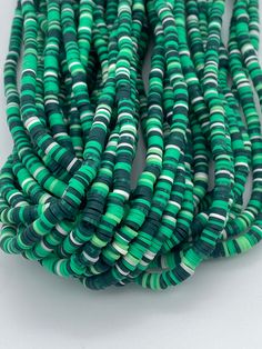 Cute green striped vinyl heishi beads. 300-400 beads per strand Size 6mm  Hole size 2mm  Length of strand 15-17" Vinyl Disc, Beads Polymer Clay, Simple Bracelets, Types Of Gemstones, Beaded Top, Heishi Beads, Silver Bangle Bracelets, Polymer Clay Beads, Top Seller