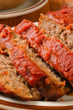 meatloaf on a plate with the words meatloaf my way