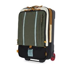 a piece of luggage that is on wheels and has stripes on the side, with a tag attached to it