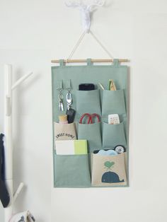 the hanging organizer is filled with personal items