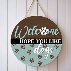 a sign that says welcome hope you like dogs