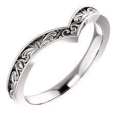 a white gold wedding ring with an intricate design