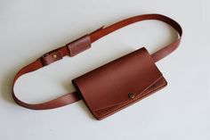 "Belt bag leather brown, leather waist bag, leather waist pack, leather handmade belt bag, minimalist leather belt bag, belt pouch wallet Minimalist brown belt bag made with high-quality genuine leather. This belt bag is the perfect accessory in any situation. Perfect for festivals, a night out, travelling and as a safe place for your phone or money. Leather belt bag has one big compartment and two pocket for credit cards and money inside. You can wear the product as a waist bag or use it as a p Belt Bag Leather, Leather Waist Pack, Waist Bag Leather, Handmade Belt, Bag Minimalist, Leather Waist Bag, Handmade Belts, Bag Belt, Leather Passport Cover