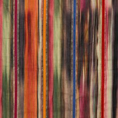 multicolored striped fabric hanging on the wall