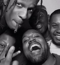 a group of people with their mouths open and one man sticking out his tongue to the camera