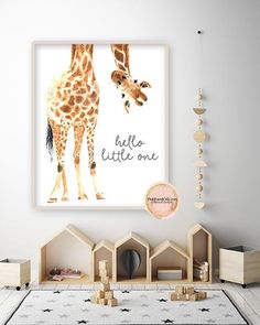 a giraffe is standing in front of a white wall with a quote on it