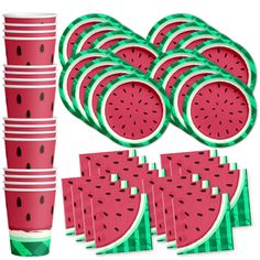 a bunch of watermelon slices sitting on top of each other next to some cups