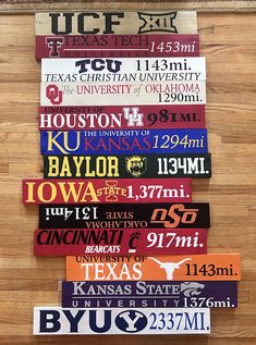 a wall hanging on the side of a building with different types of license plates attached to it