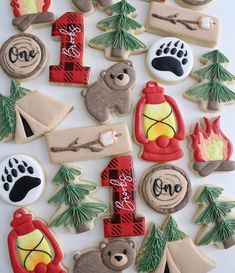 decorated cookies are arranged in the shape of letters and numbers, including one with a bear