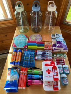 the table is covered with many different items for making water bottles and other things to put in them