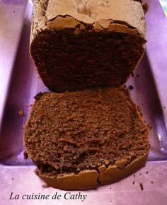 a loaf of bread sitting on top of a purple tray