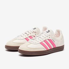 Rule the streets and the pitch with the adidas Originals Womens Samba OG in Cloud WhiteLucid PinkWonder White, featuring an iconic 3stripes look in smooth leather and reinforced toe, straight from the archives. The adidas Originals Womens Samba OG is a revisit to the classic Samba design, still relevant and sliding onto your feet for superb style over 70 years later. Smooth leather and serrated 3stripe overlays looks just as good now as they did back in the day, adding a touch of retro to your d Adidas Shoes Women Samba, Cute Sambas, Pink And White Sambas, Addidas Shoes Samba Womens, Adidas Samba Pink, Sambas Pink, Samba Pink Laces, Sambas Adidas Women, Pink Sambas