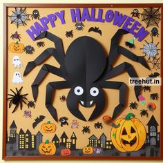 a paper cut out of a spider with halloween decorations