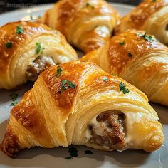 These crescent rolls are filled with seasoned sausage, cream cheese, and optional cheddar – perfect for parties or snacking. Lunch With Crescent Rolls, Sausage And Cheese Crescent Ring, Christmas Breakfast Snacks, Best Savory Appetizers, Sausage Rolls With Crescent Rolls, Sausage Roll Recipes, Appetizers For Christmas Party, Savory Christmas Snacks, Seasonal Appetizers