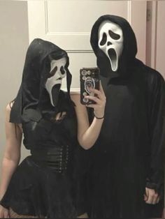 two people dressed up in halloween costumes taking a selfie