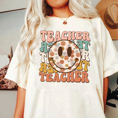 "Teacher Shirt, Groovy Teacher Shirt, Back To School Shirt, Teacher Sweatshirt, Teacher Team, Gift For Teacher, Teacher Appreciation Gift ↓ Click here to view our additional fashionable collections ↓ https://handcraftedbyhelenn.etsy.com Product Details: - 100% Cotton (fiber content may vary for different colors) - Medium fabric (5.3 oz/yd2 (180 g/m2)) - Classic fit - Tear away label - Runs true to size Care instructions: - Machine wash: warm (max 40C or 105F); - Non-chlorine: bleach as needed; - Groovy School Shirt, Groovy Teacher Shirt, Retro Long Sleeve Printed T-shirt, Funny Printed Tops With Relaxed Fit, Funny Multicolor Relaxed Fit Tops, Casual White T-shirt For Teacher Appreciation, Funny Printed Cotton Shirt, Funny White Long Sleeve Shirt, Trendy Screen Print Top For Teacher Appreciation