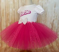 Barbie Birthday Tutu Outfit by Little Ladybug Tutus. Please check our website's home page for current turnaround time. Since all items are handmade at the time of purchase, there is a production time that varies. I hope my customers all understand that I am a one woman shop and create my items to surpass expectations. Every item ordered is handmade at the time of purchase. I also hope you understand that the wait is worth it! Shipping Information We offer FREE SHIPPING on all orders within the U Whimsical Tutu Dress For Birthday And Easter, Whimsical Tutu Dress For Easter Birthday, Fun White Tutu Dress For Birthday, Pink Princess Dress For Carnival, White Fun Tutu Dress For Party, Pink Tutu Dress For Carnival Party, White Tutu Dress For Party, Easter Birthday Fitted Tutu Dress, Fitted Tutu Dress For Easter Birthday