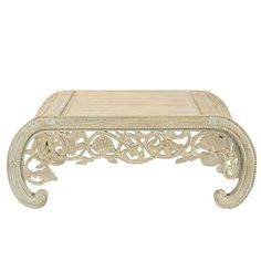 an ornately carved coffee table with marble top and wooden base, on white background