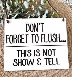 a sign that says don't forget to flush this is not show & tell