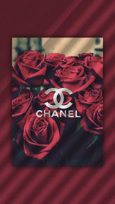 red roses with the word chanel on it in front of an image of a chanel logo