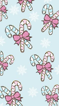 candy canes and bows on a pink background